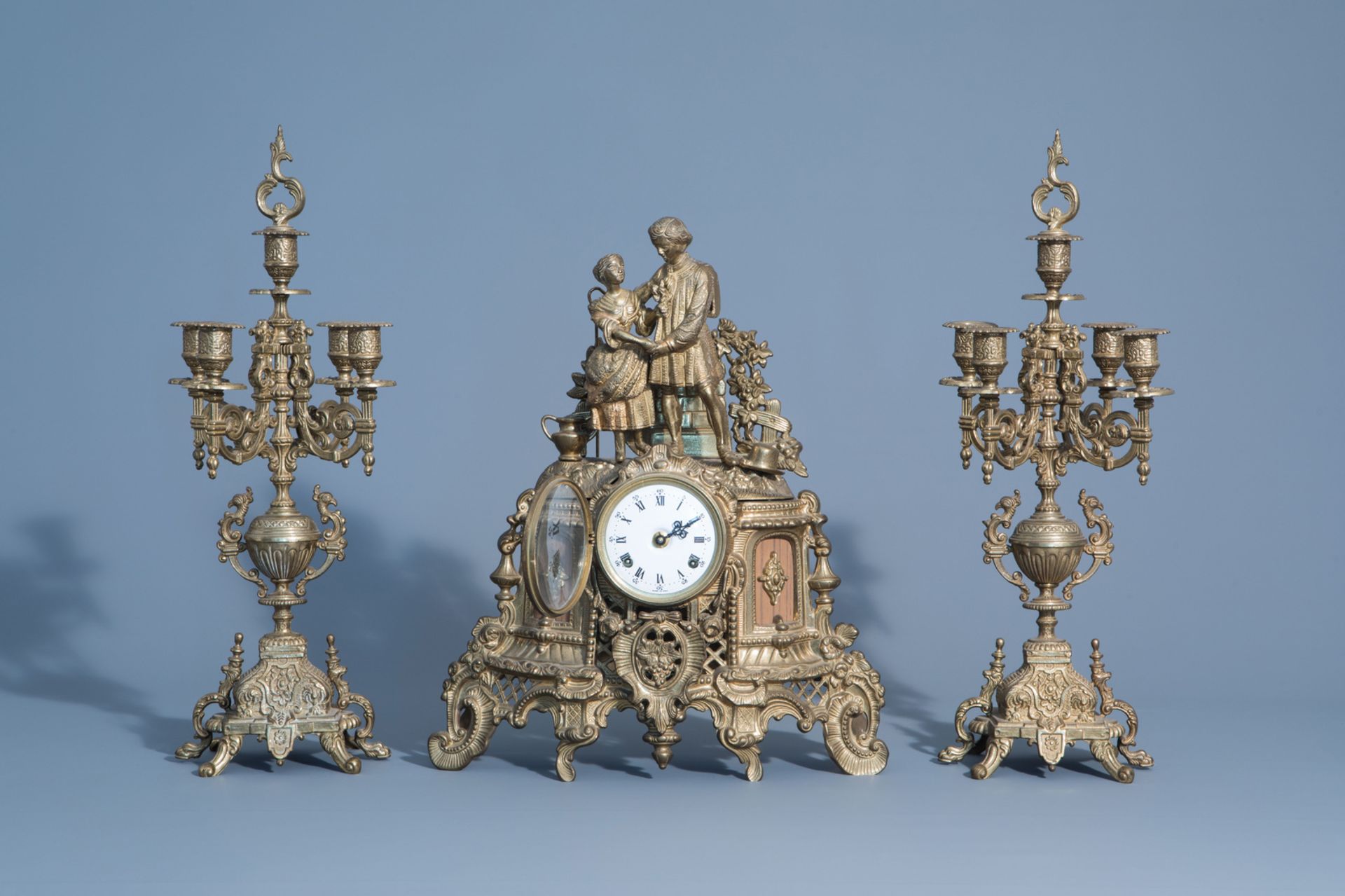 A French three-piece gilt metal romantic clock garniture, 19th/20th C. - Image 2 of 8