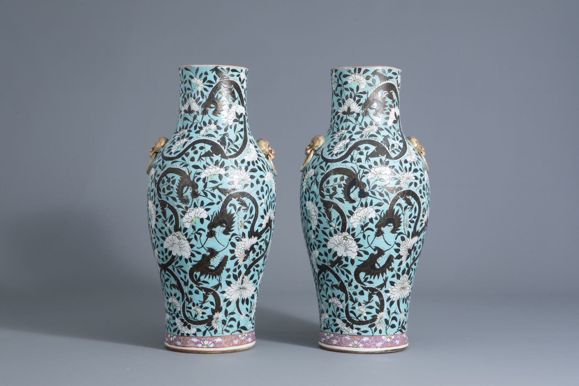 A pair of Chinese turquoise ground dragon vases, 19th C.