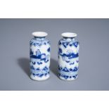 A pair of Chinese blue and white miniature rouleau vases, Kangxi