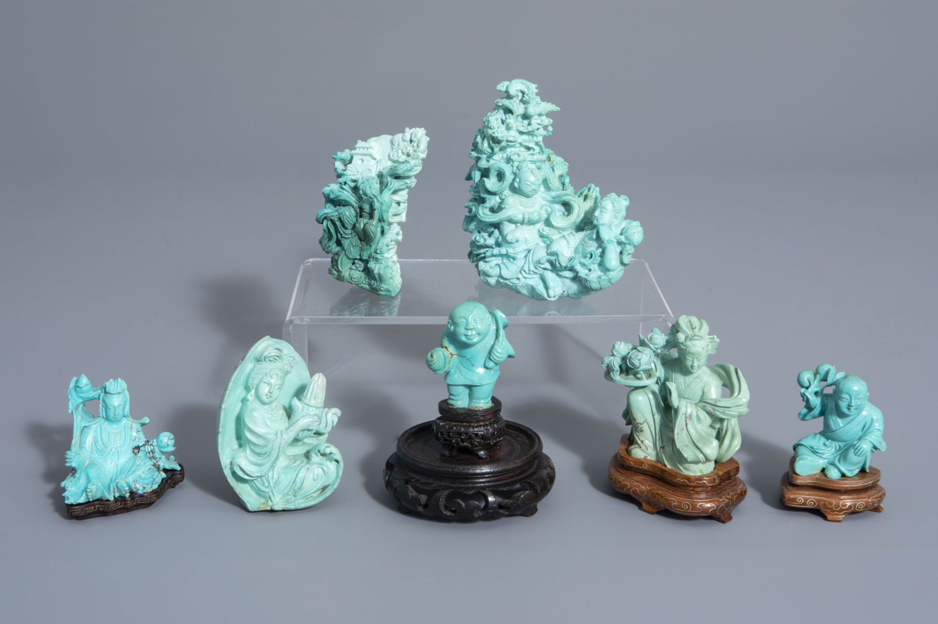 Seven Chinese carved turquoise figures, 20th C.