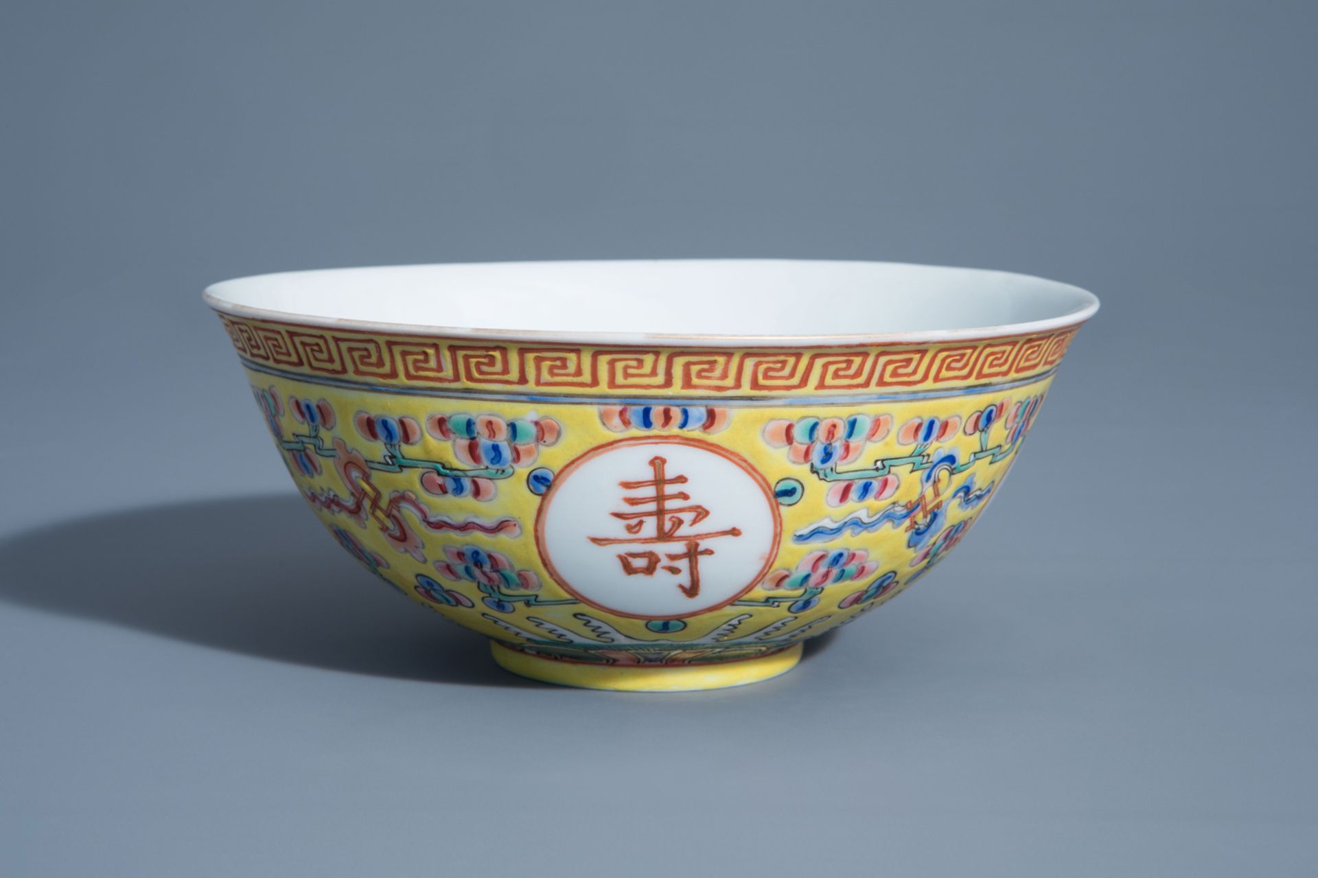 A Chinese famille rose yellow ground 'bats' bowl, Guangxu mark, 19th/20th C.