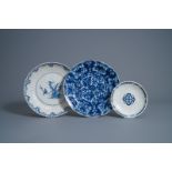 Two Dutch Delft blue and white dishes and a plate with floral design, early 18th C.