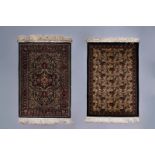 Two Oriental rugs with floral design, silk on cotton, 20th C.