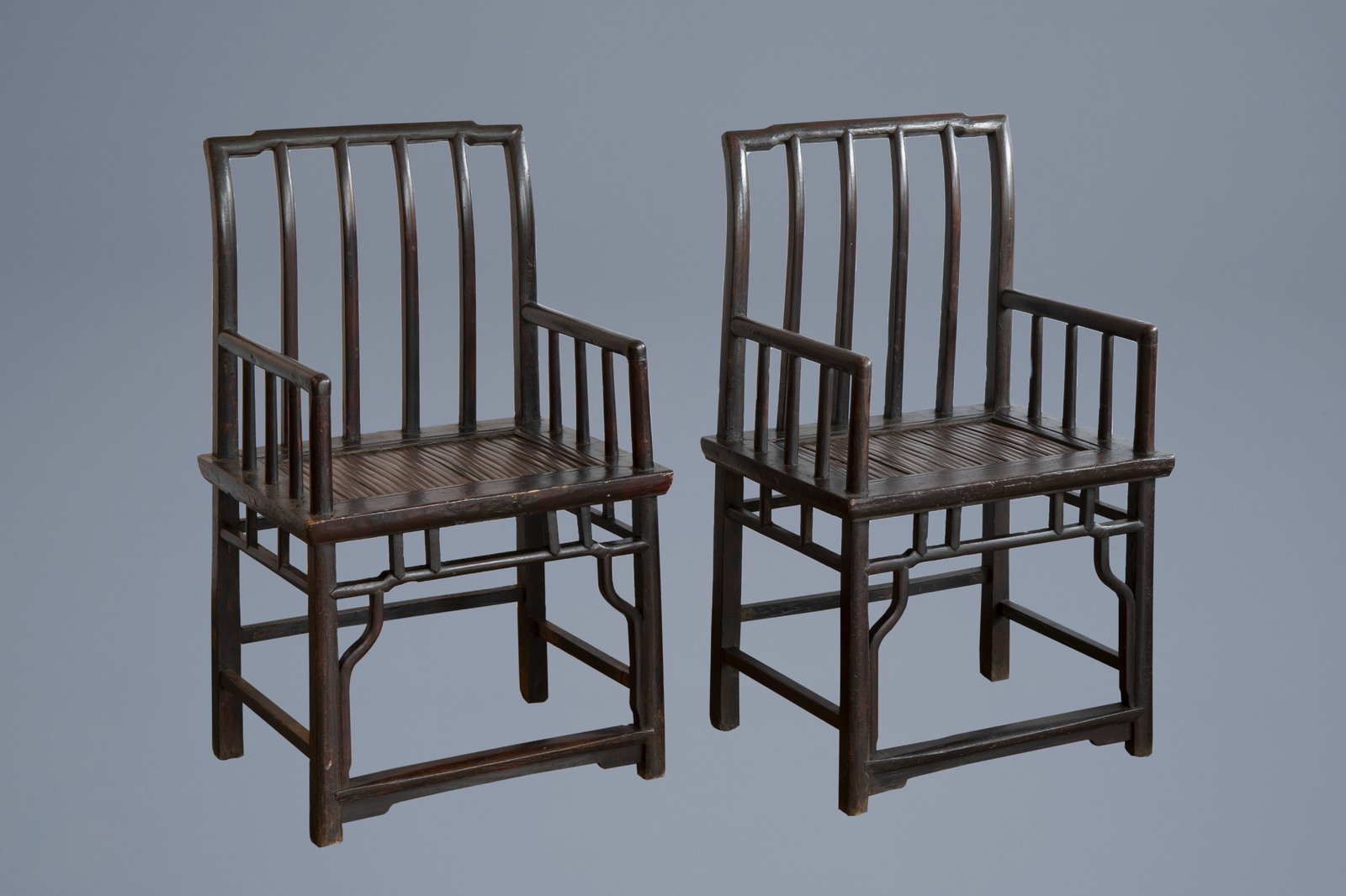 A pair of Chinese lacquered wooden chairs, first half of the 20th C.