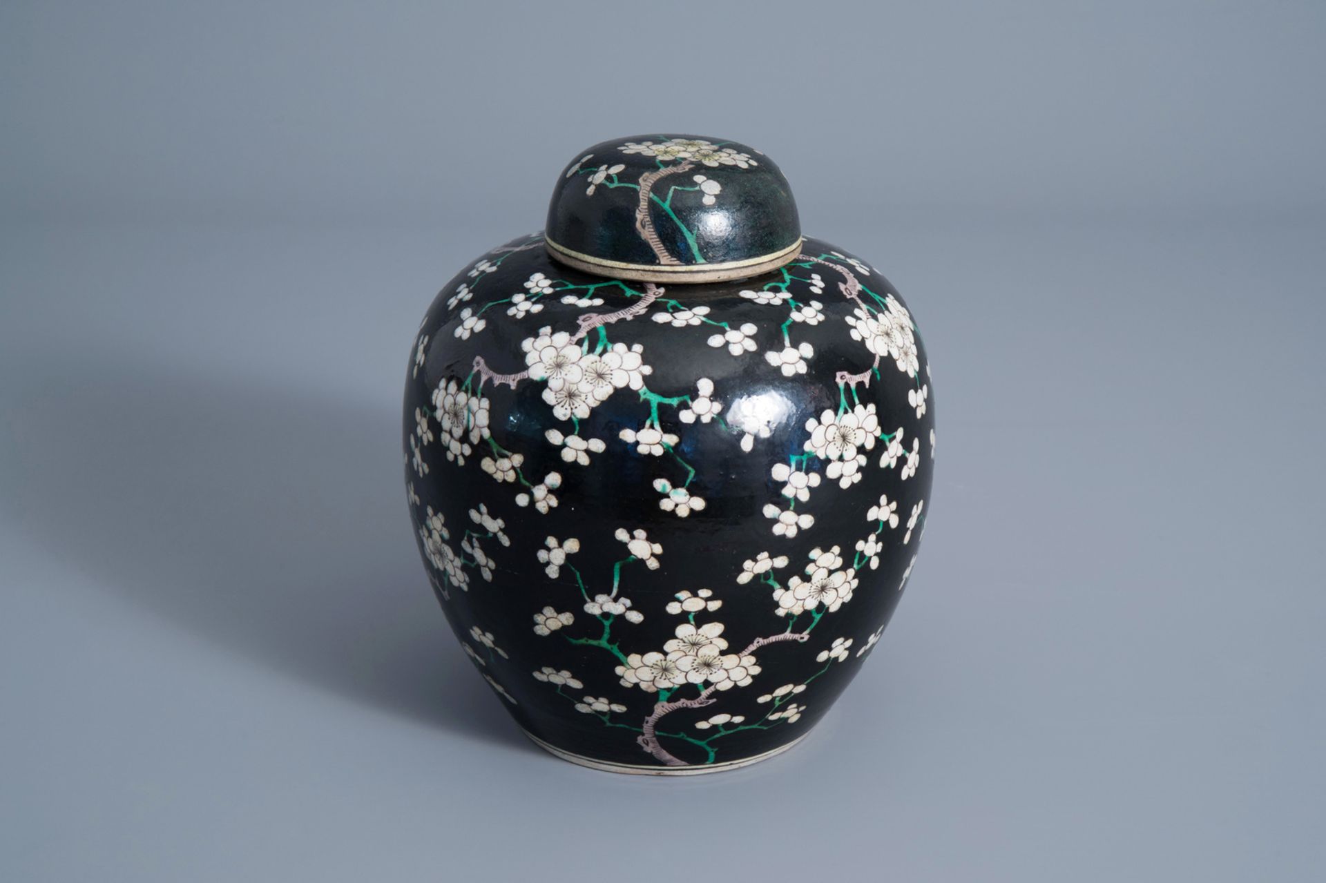 A Chinese black ground jar and cover with floral design, Chenghua mark, 19th C.