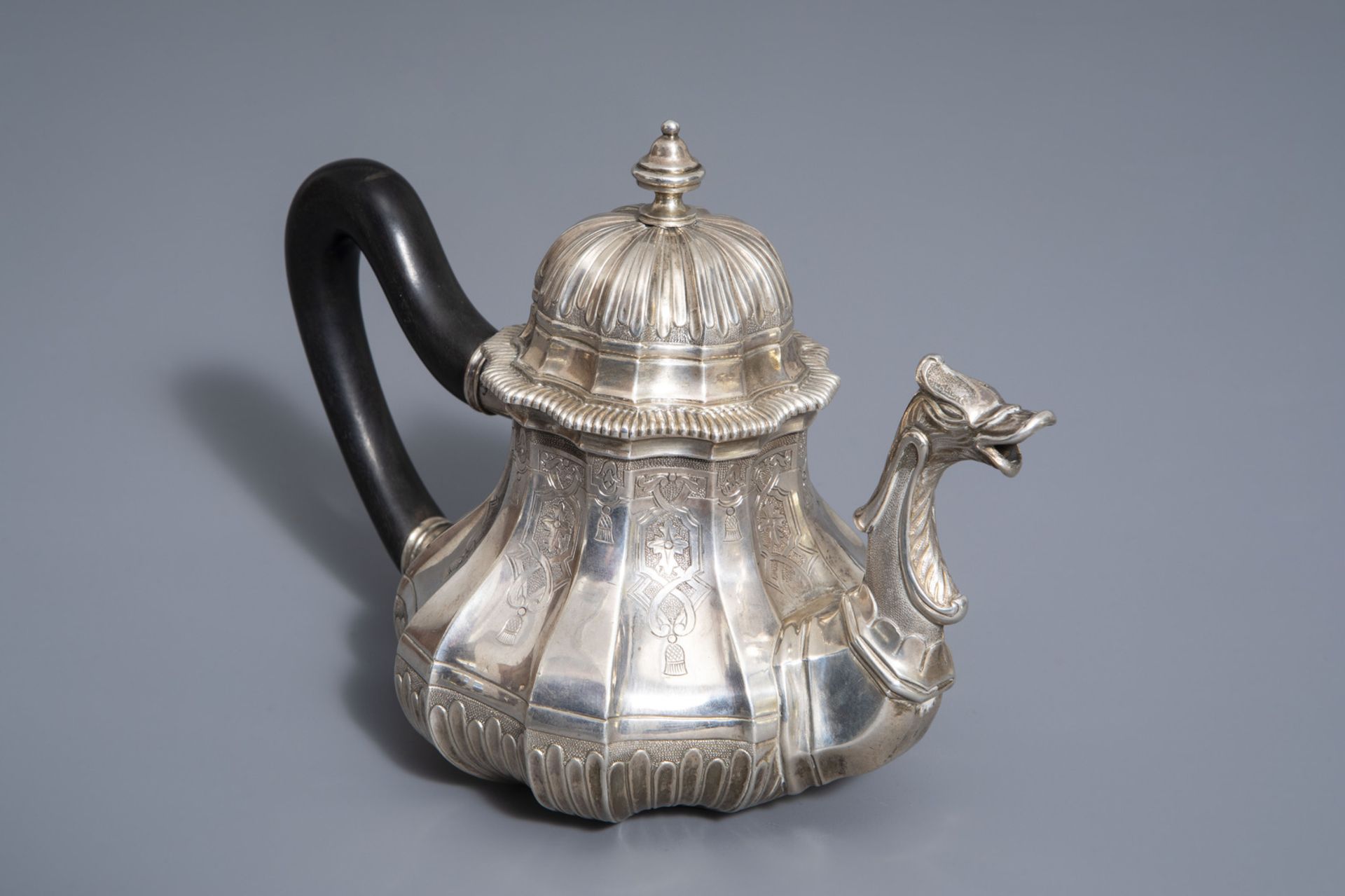 A refined Baroque silver teapot and cover with ebony handle, Ghent, Belgium, probably 19th C.