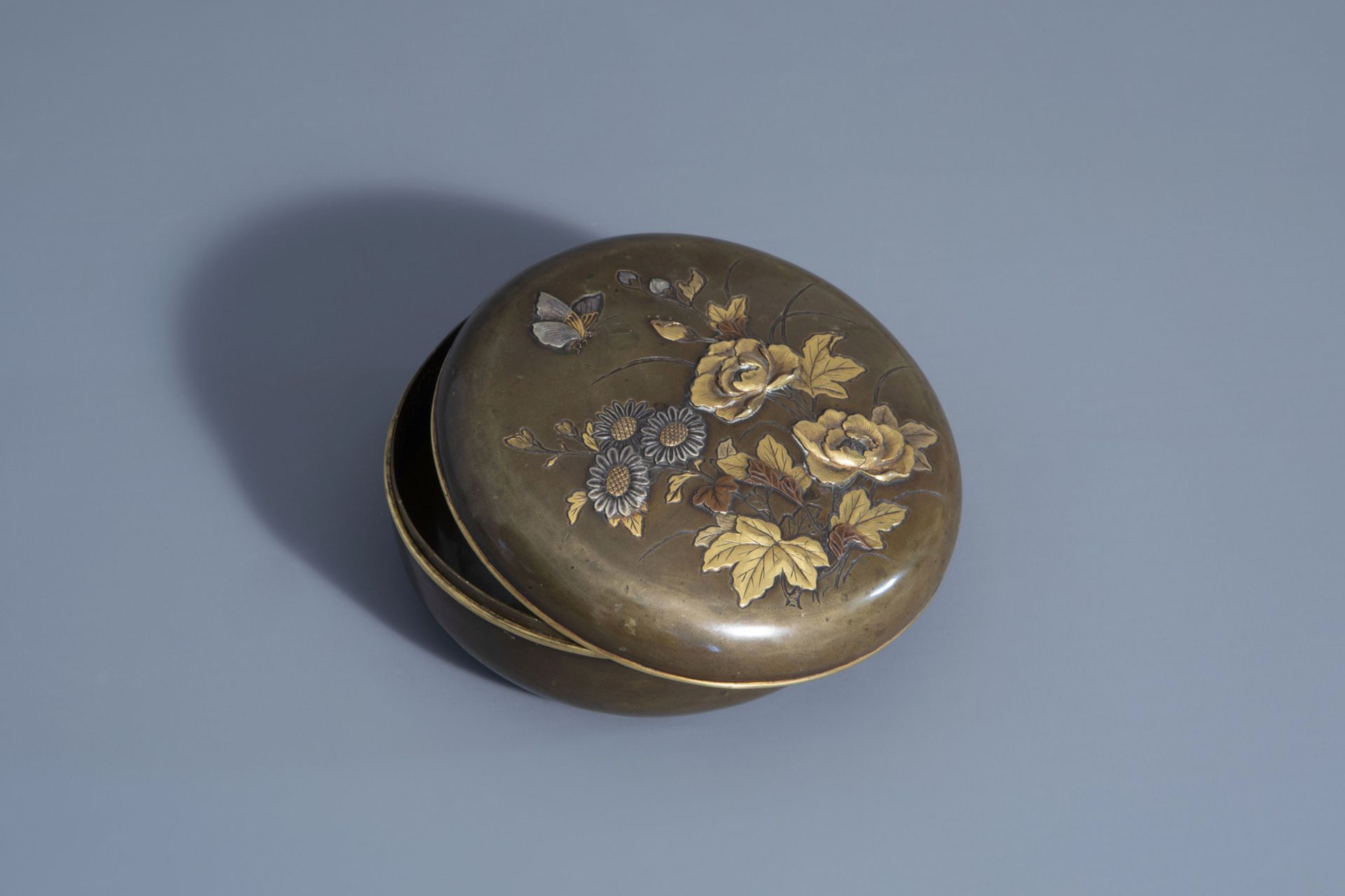 A Japanese mixed metal box and cover with inscription on the base, Meiji, 19th C.