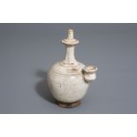 A Chinese white glazed ceremonial Buddhist 'kundika' ewer, Tang