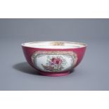 A Chinese famille rose 'ruby ground' bowl with floral design, Yongzheng