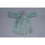 A Chinese turquoise ground embroidered silk robe with flowers and butterflies, 19th C.