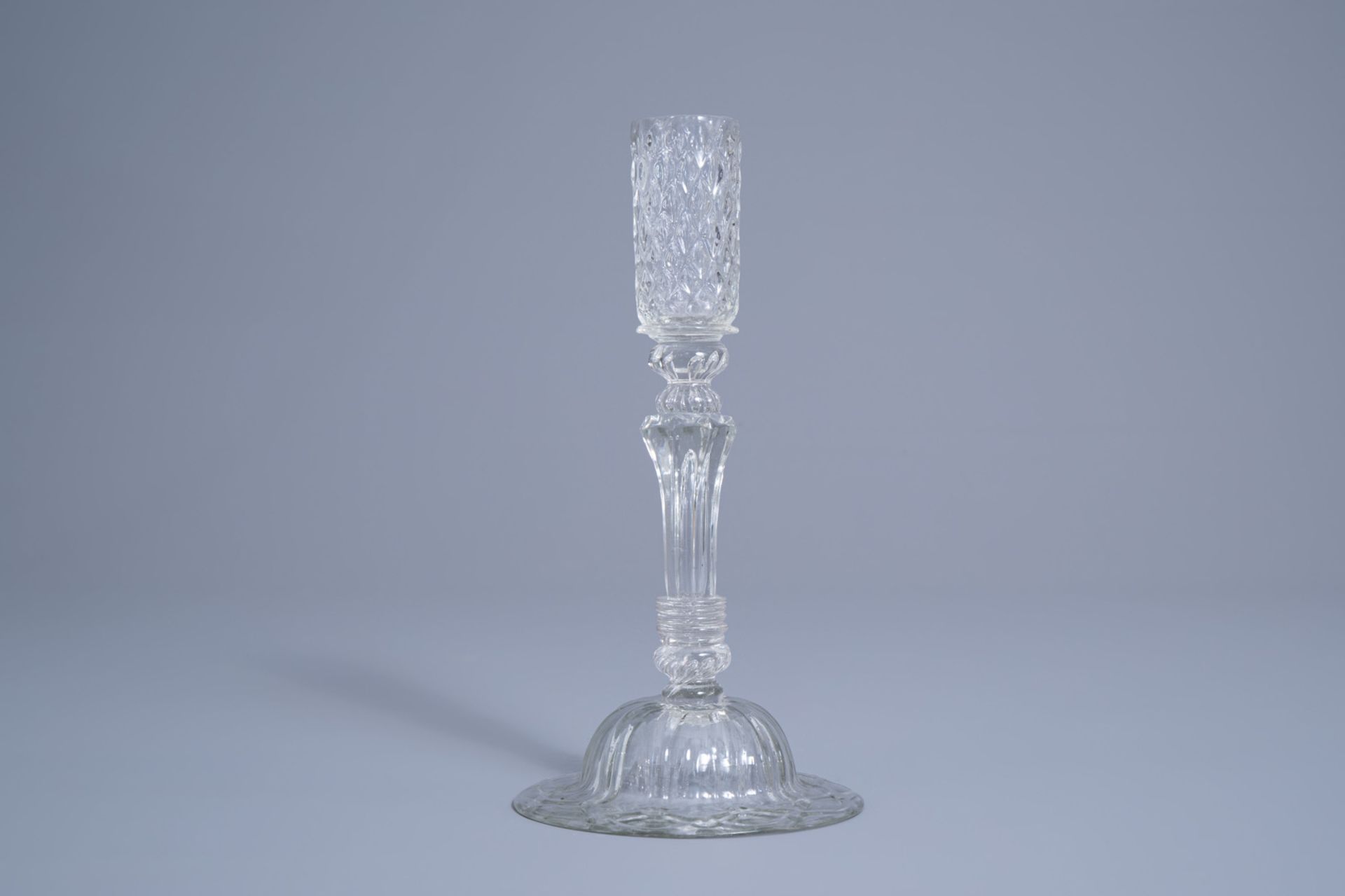 A mouth-blown glass candlestick with a moulded eight-sided pedestal stem, possibly Lige, 18th C. - Image 4 of 7