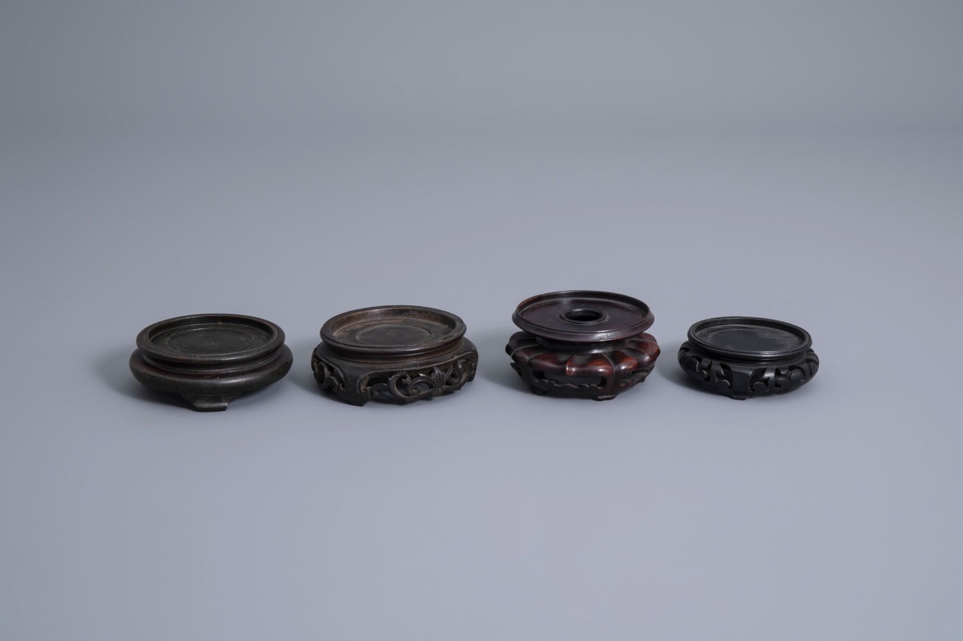 A collection of Chinese wooden stands and a collection of plate holders, 19th/20th C. - Image 17 of 19