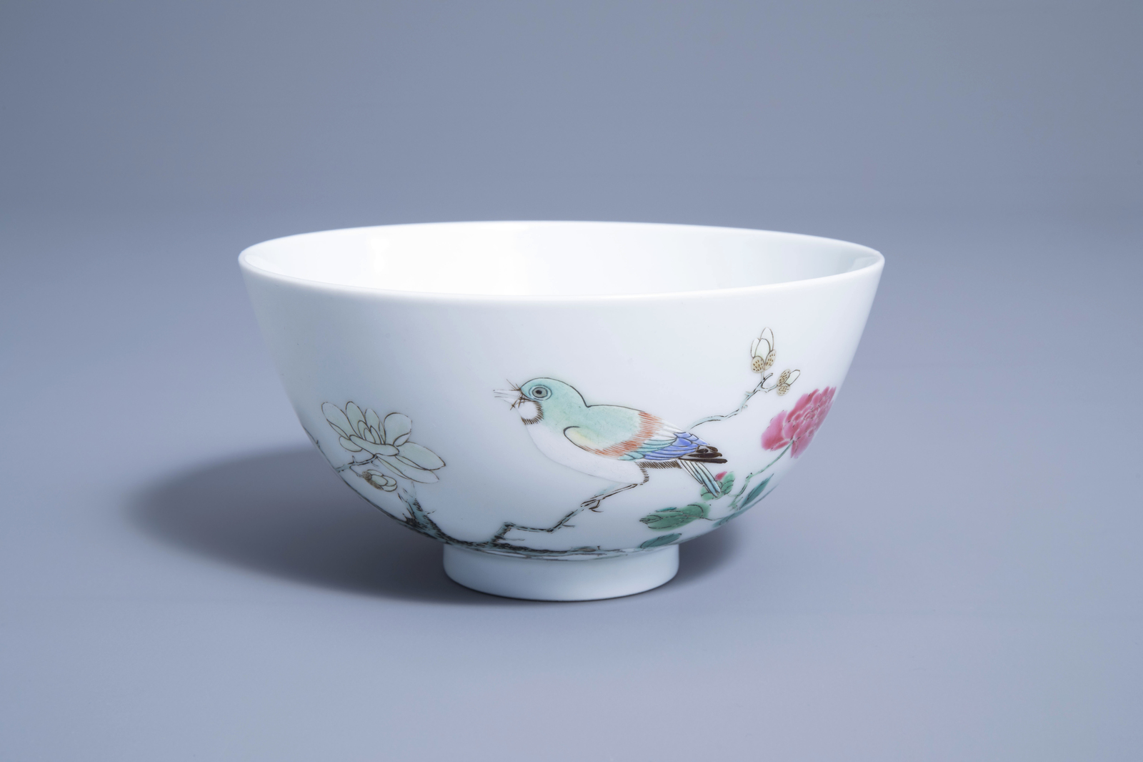 A Chinese famille rose bowl with a bird on a blossoming branch, Yongzheng mark, 19th/20th C.