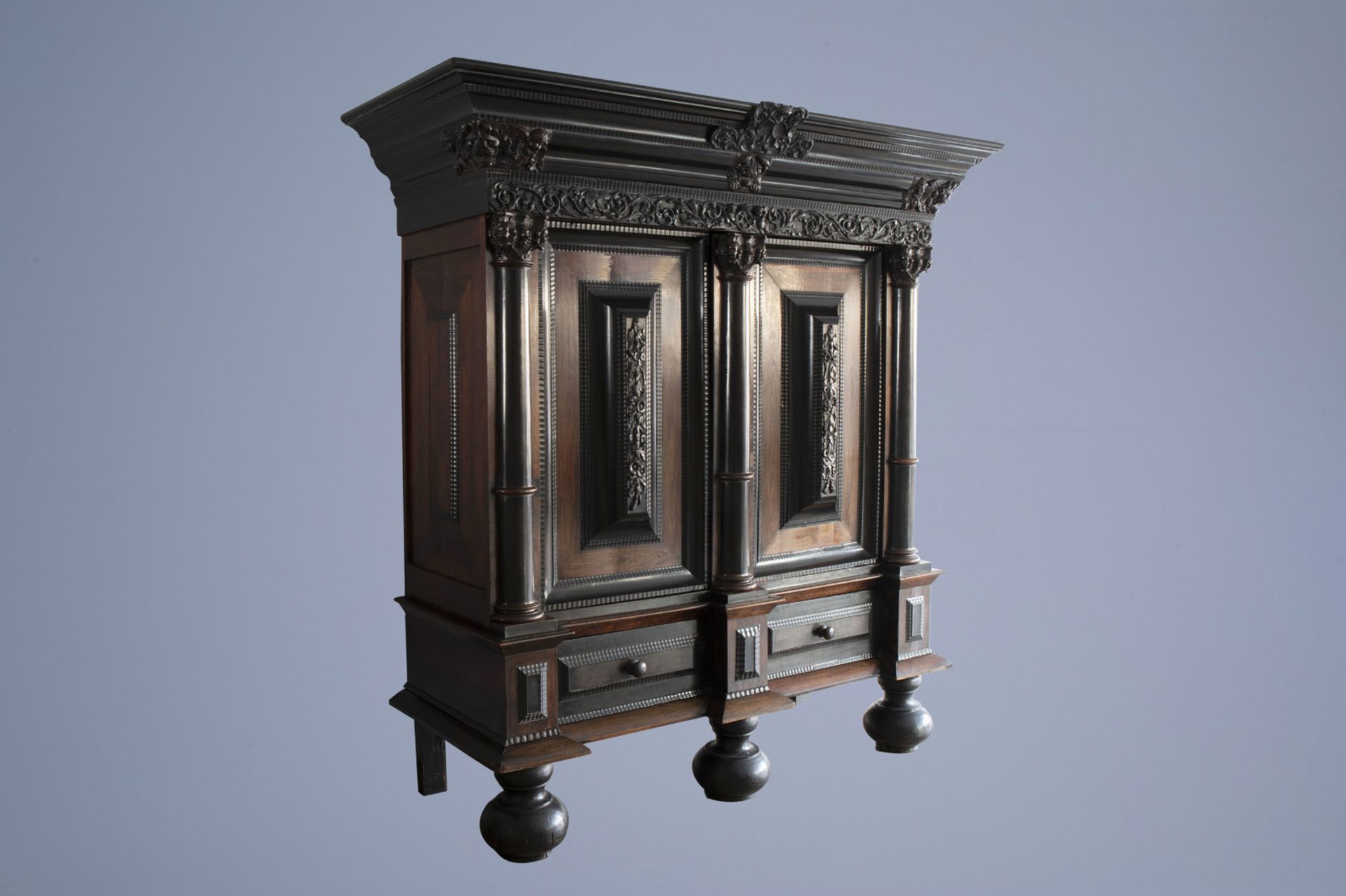 A Dutch two-door ebonized and rosewooden 'Kussenkast' cupboard, ca. 1700