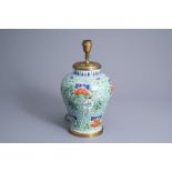A Chinese lamp mounted wucai vase with floral design, 19th C.