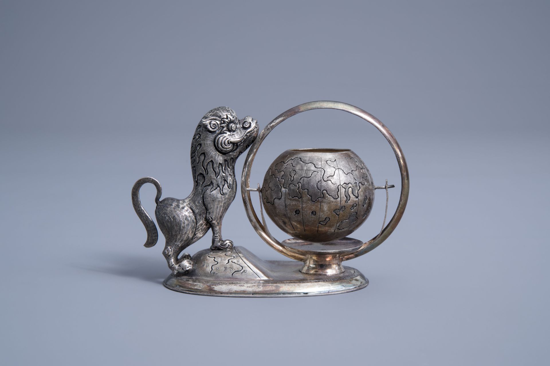 A Vietnamese silver tea strainer in the shape of a mythical animal playing with a globe, 800/000, 19 - Image 3 of 11