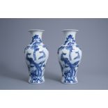 A pair of Chinese blue and white 'phoenix' vases, Republic, 20th C.