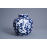 A Chinese blue and white prunus on cracked ice ground jar and cover with antiquities, 19th C.