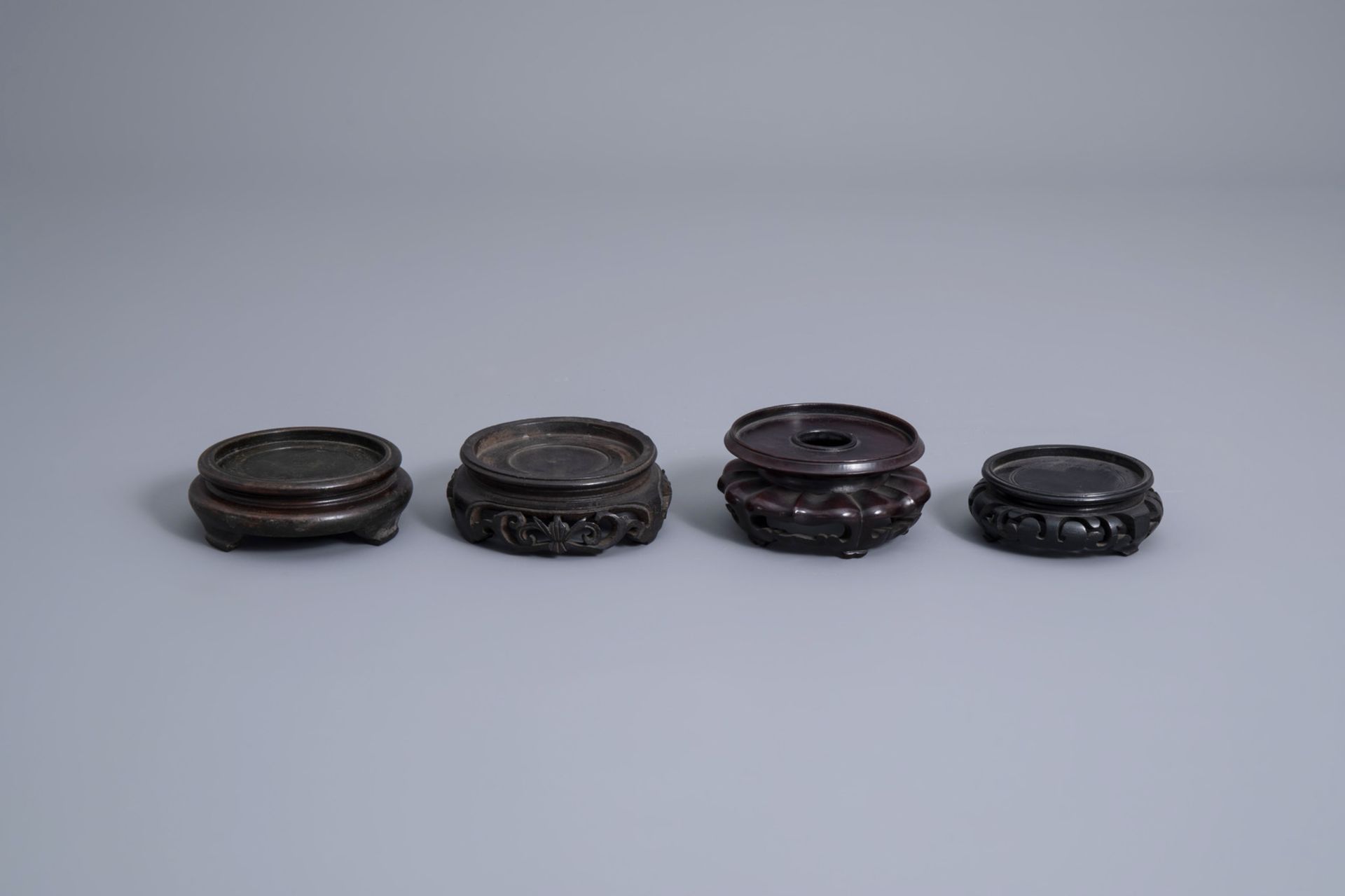 A collection of Chinese wooden stands and a collection of plate holders, 19th/20th C. - Image 14 of 19