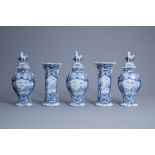 A Dutch Delft blue and white five-piece vase garniture with a farmer at work, 18th C.