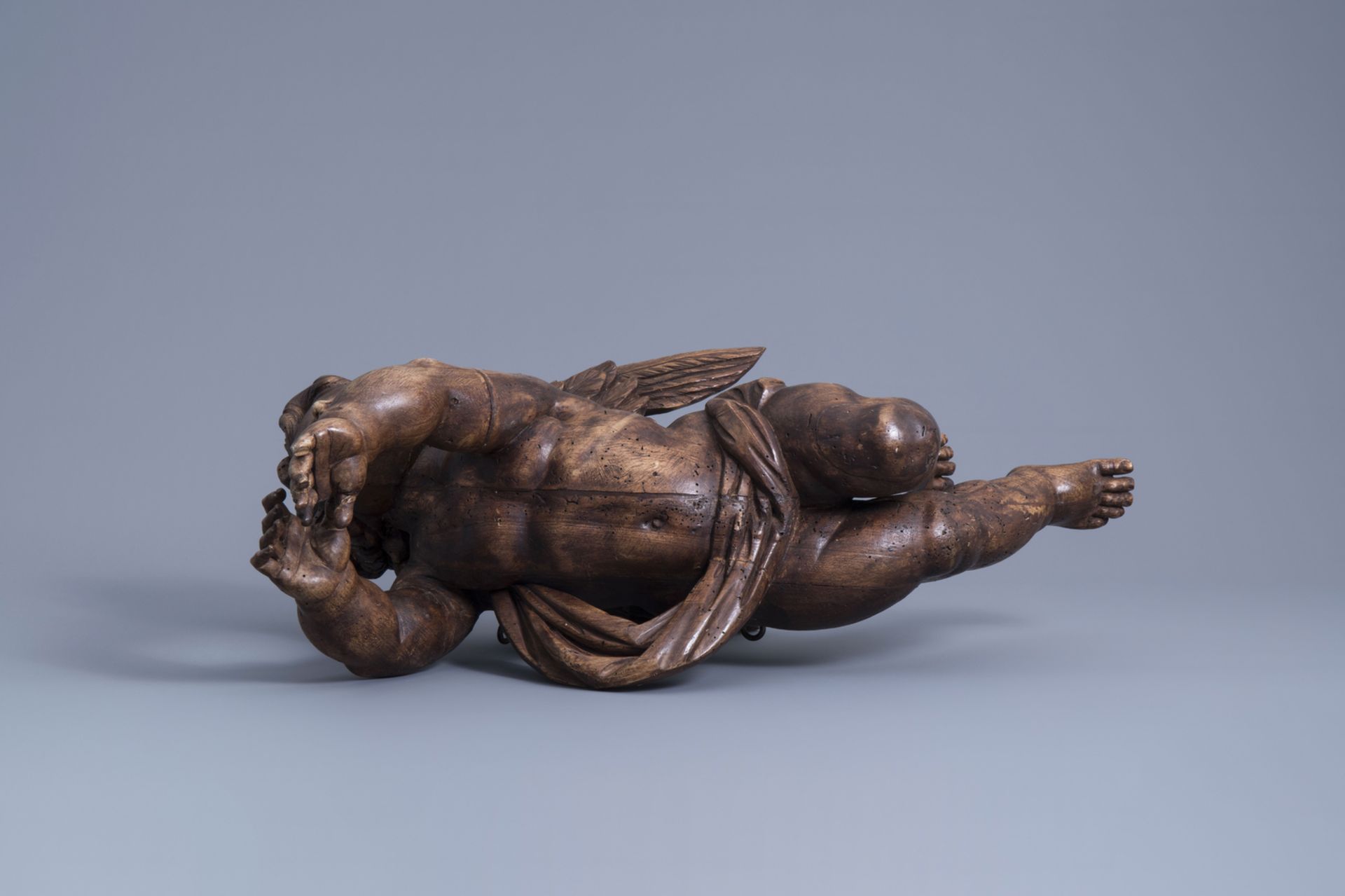 A patinated carved wooden figure of a putto, Southern Netherlands, 18th C. - Image 7 of 7