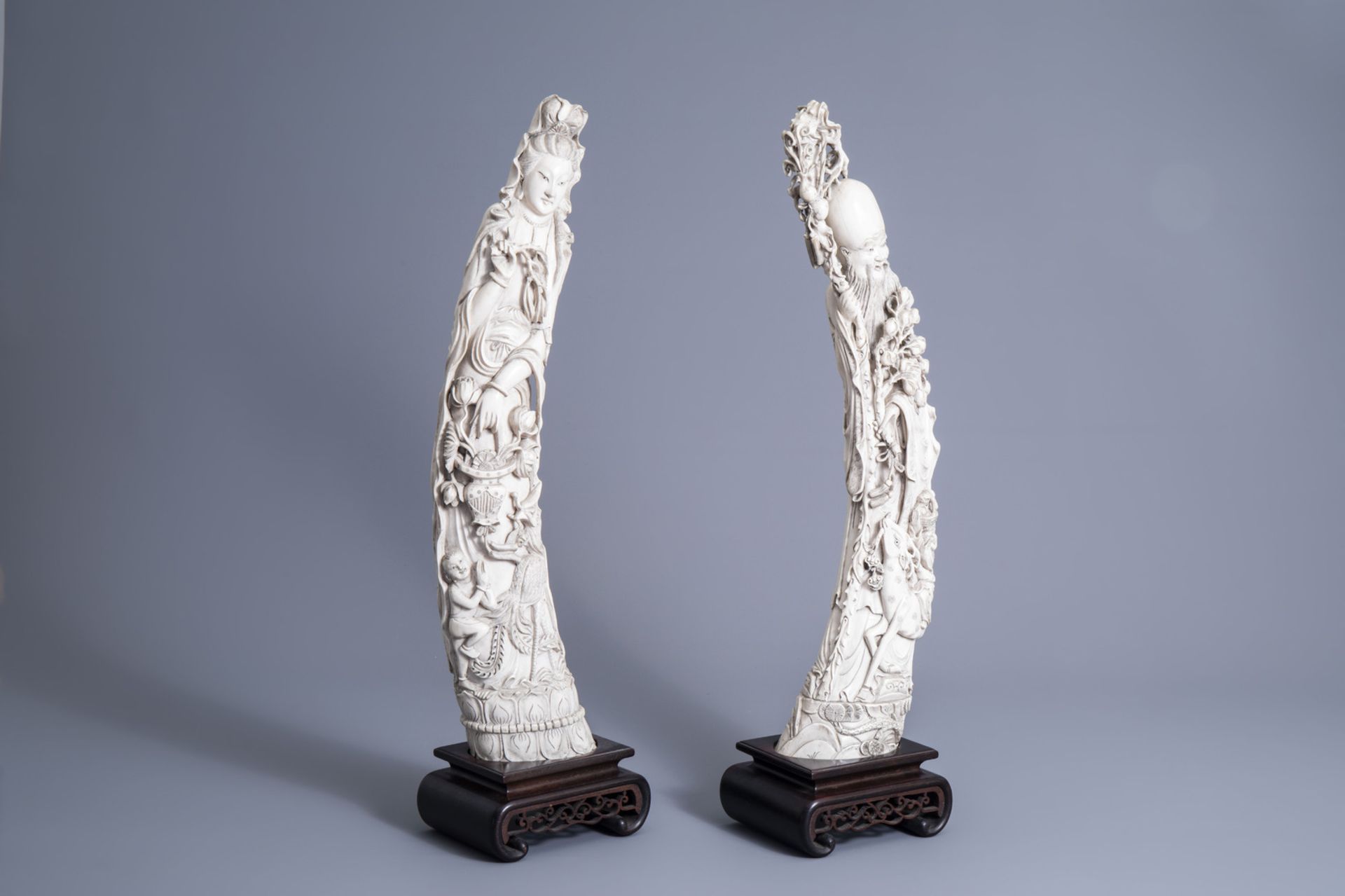 Two large Chinese carved ivory figures of immortals, early 20th C.