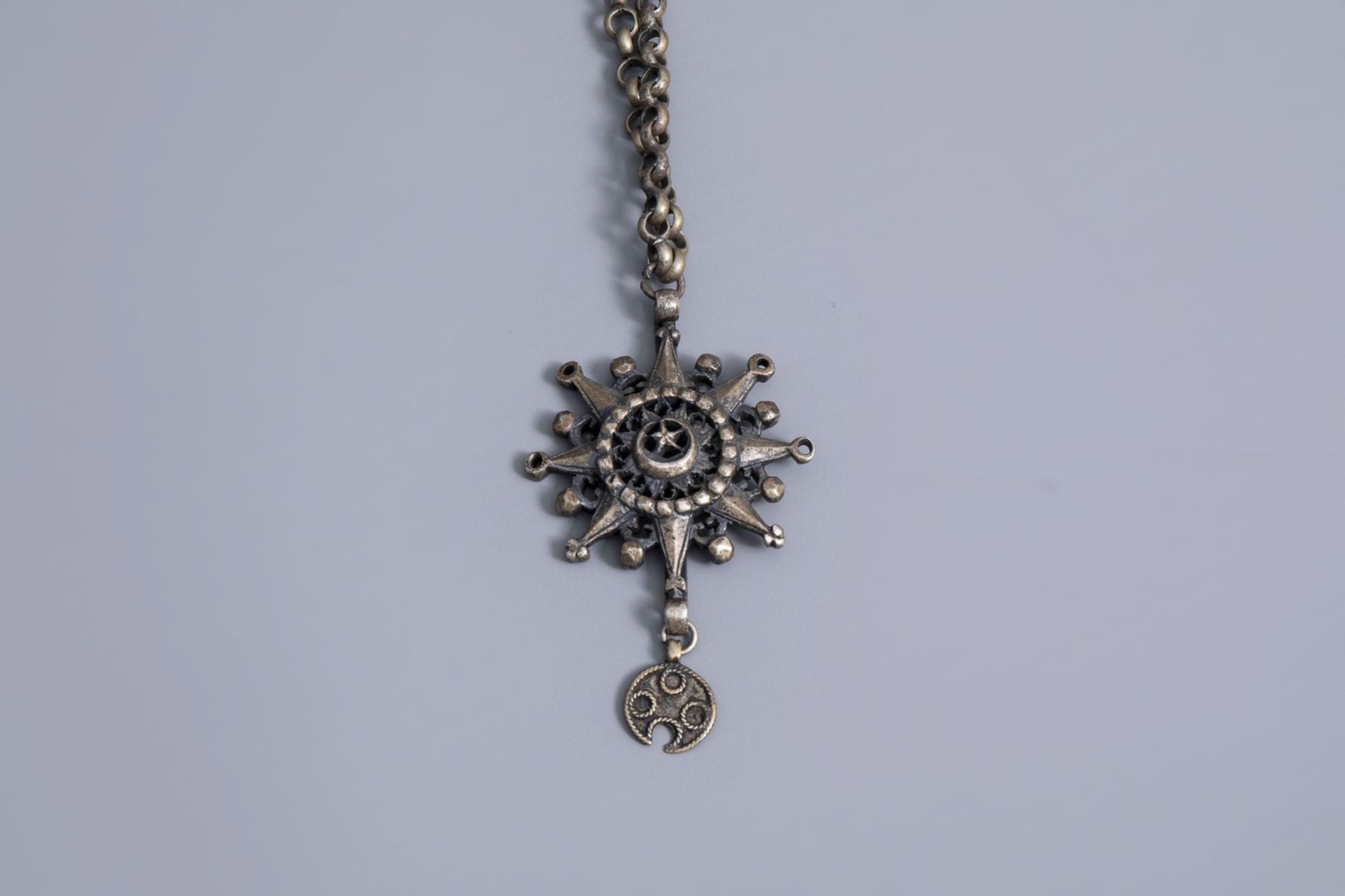 A varied collection of partly silver religious necklaces and crosses, various origins, 19th/20th C. - Image 9 of 12