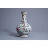 A Chinese famille rose crackle glazed 'dragon and phoenix' bottle vase, 19th C.