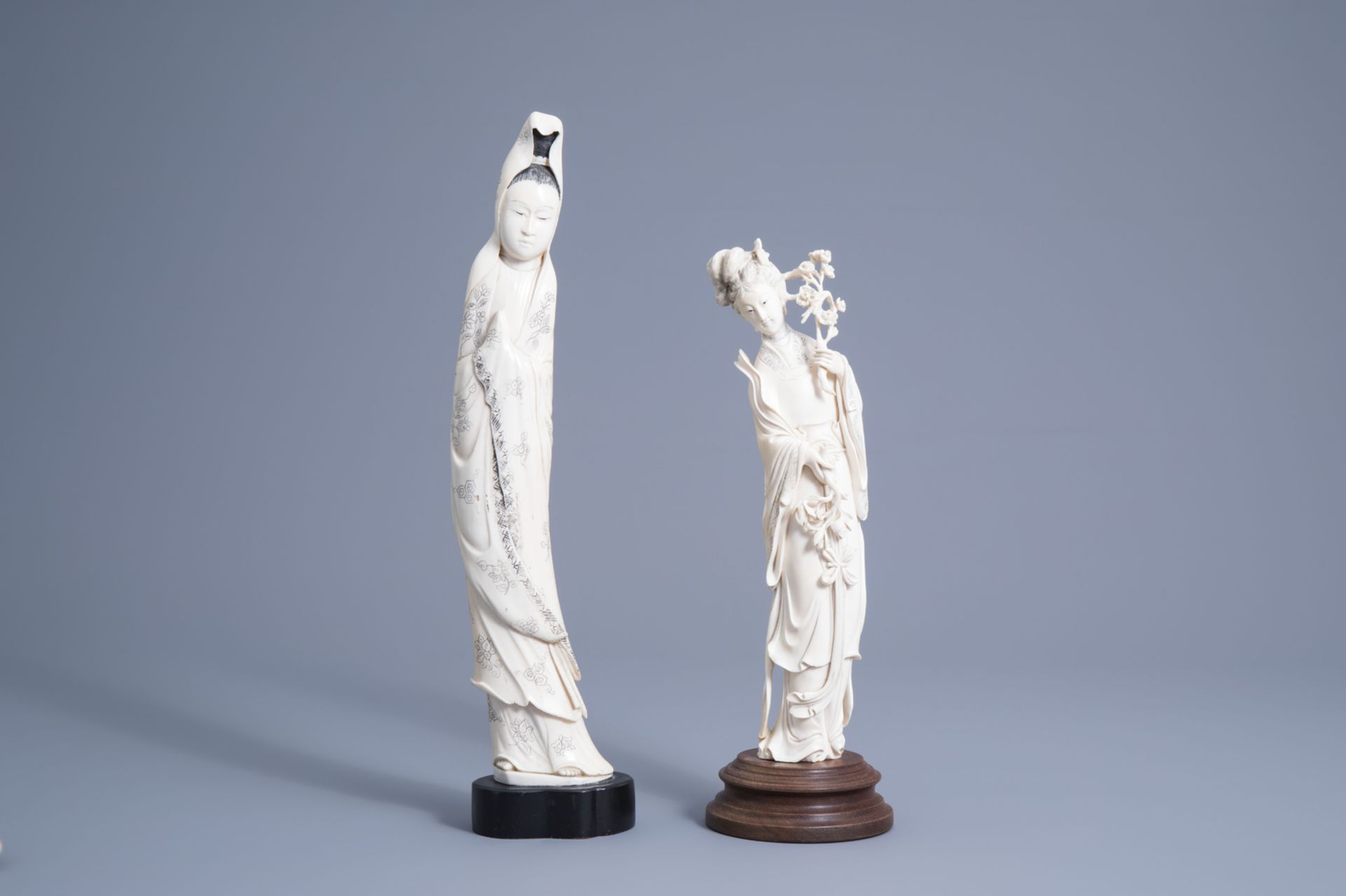 A large Chinese ivory figure of Guanyin and one of a lady with blossoming branches, early 20th C.