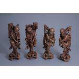 Four Chinese carved wooden figures of immortals, 19th/20th C.