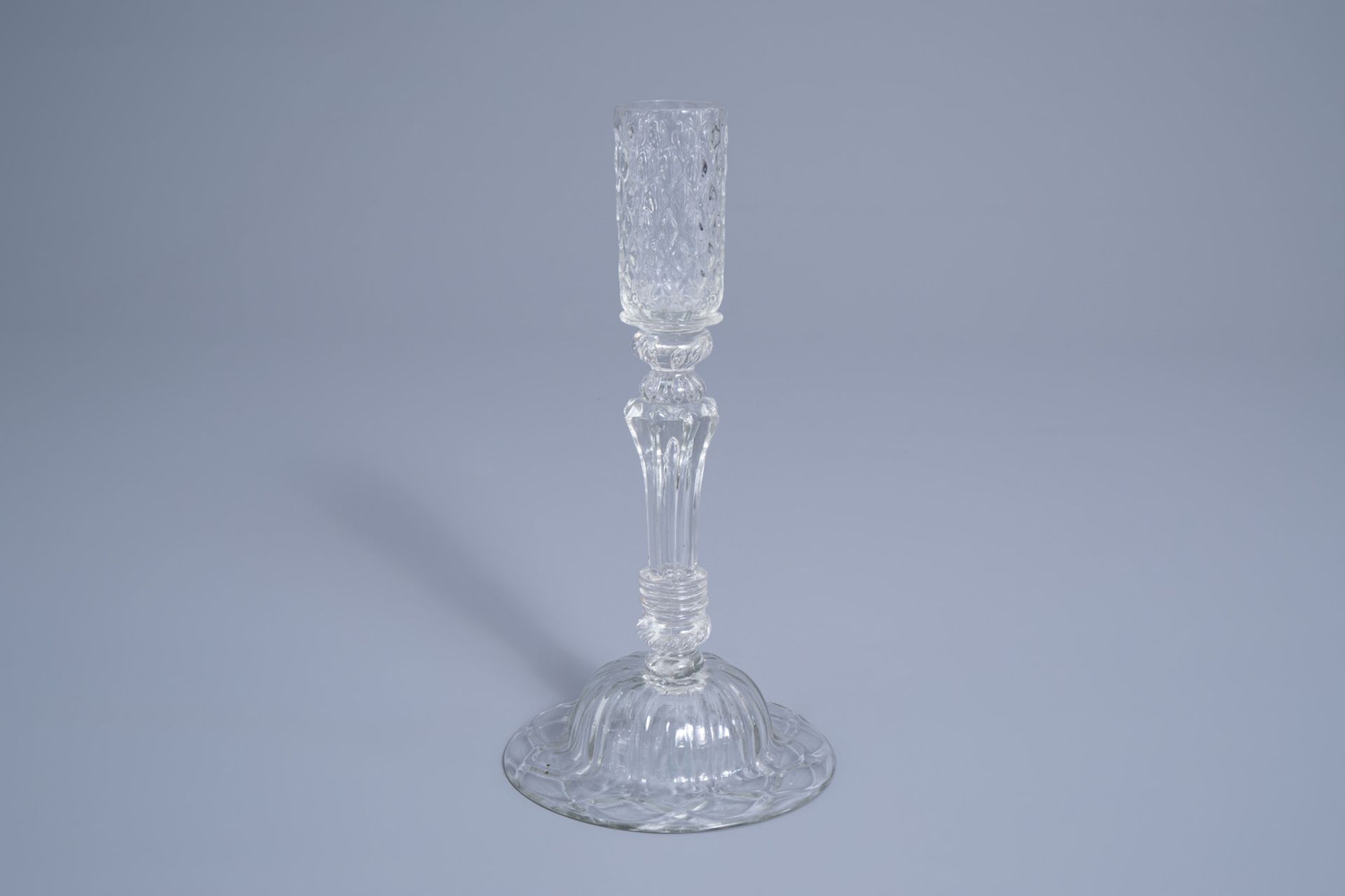 A mouth-blown glass candlestick with a moulded eight-sided pedestal stem, possibly Lige, 18th C. - Image 5 of 7