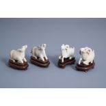 A pair of Chinese ivory models of rams and a pair of sheep, second quarter of the 20th C.