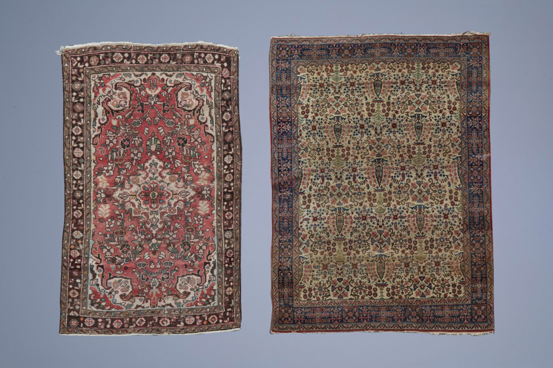 Two Oriental rugs with floral design, wool on cotton, 20th C.