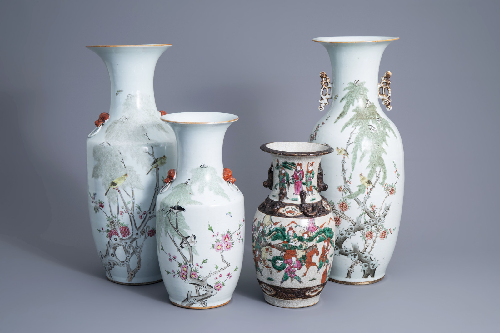 Three Chinese qianjiang cai vases with birds among blossoming branches and a Nanking crackle glazed