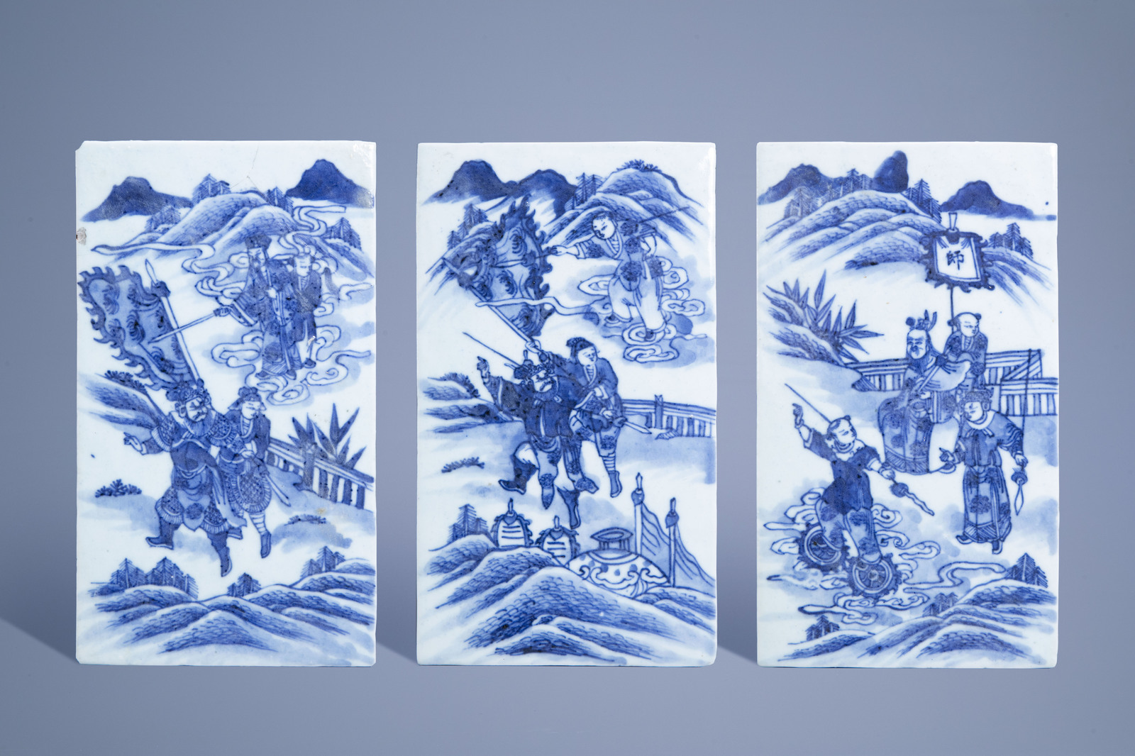 Three rectangular Chinese blue and white plaques with figures in a landscape, 19th C.