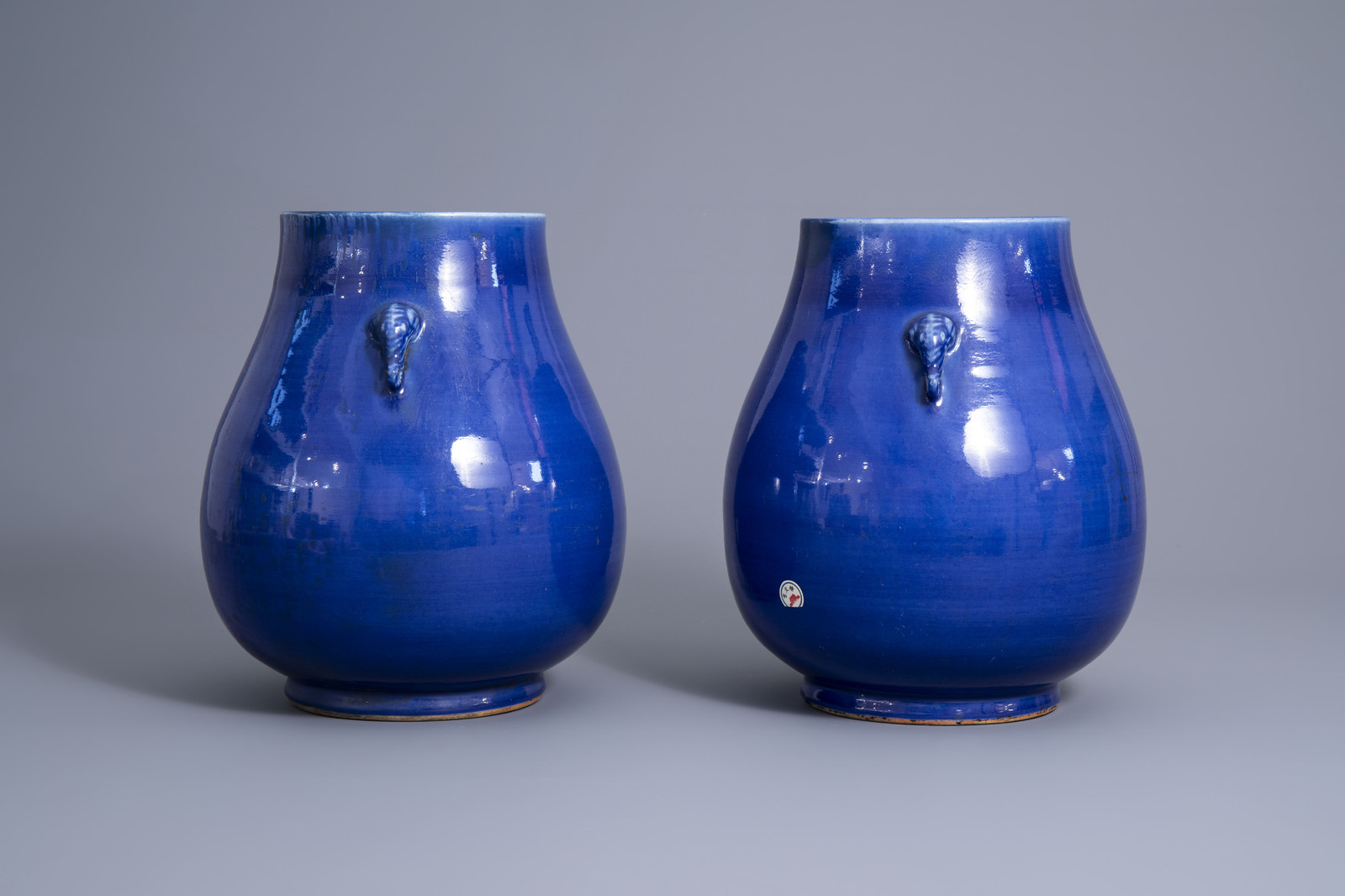 A pair of Chinese monochrome blue 'hu' vases, 19th C. - Image 3 of 8