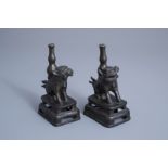 A pair of Chinese bronze joss-stick holders modelled as Buddhist lions, Ming