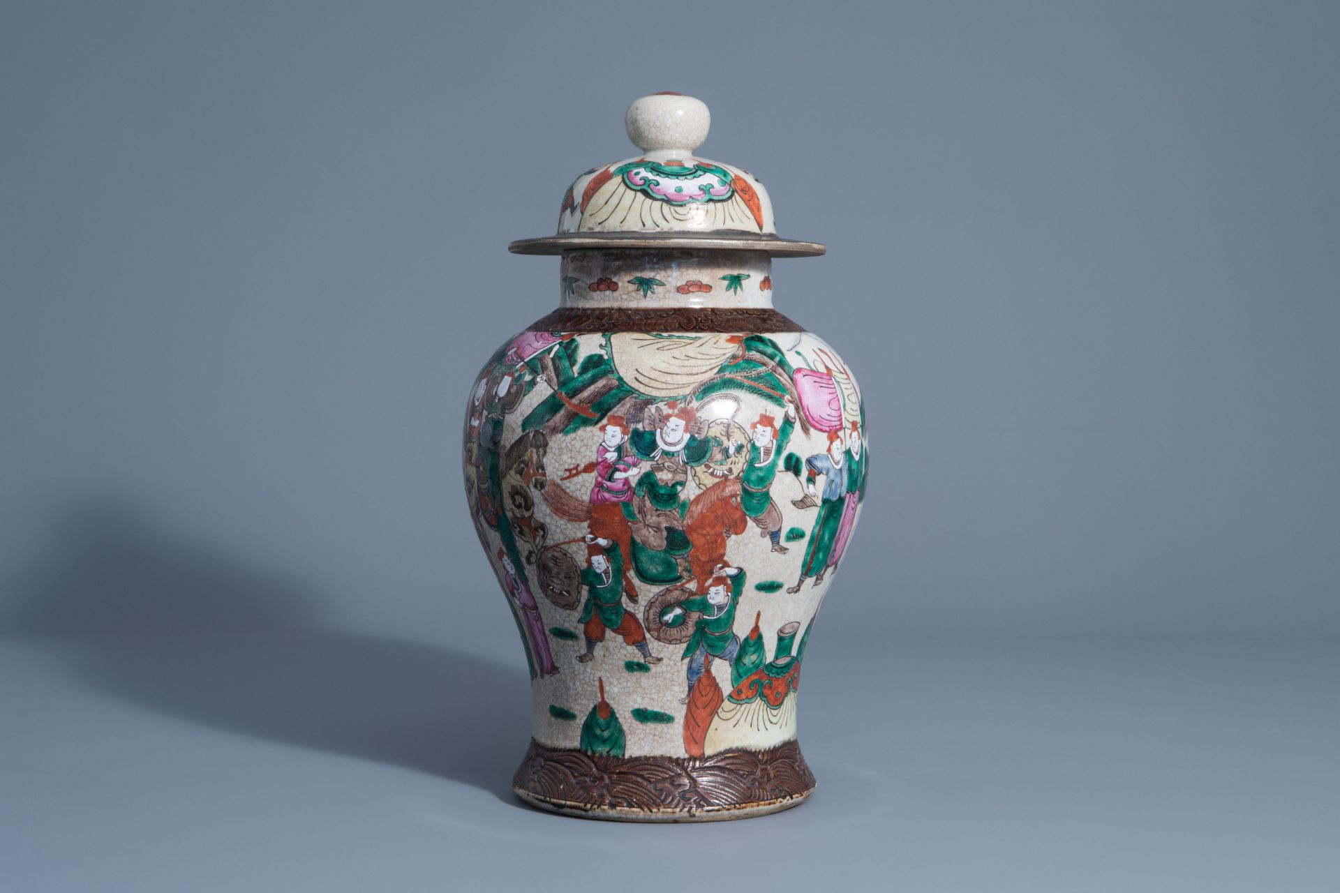 A Chinese Nanking crackle glazed famille rose vase with warrior scenes, 19th C.