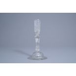 A mouth-blown glass candlestick with a moulded eight-sided pedestal stem, possibly Lige, 18th C.