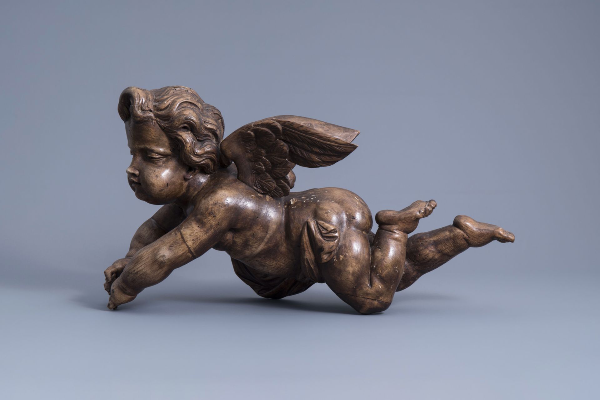 A patinated carved wooden figure of a putto, Southern Netherlands, 18th C. - Image 2 of 7