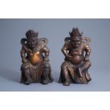 Two Chinese lacquered and gilt wooden figures of guardians, Qing
