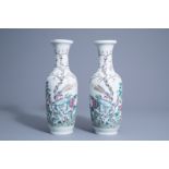 A pair of Chinese famille rose vases with birds among blossoming branches, 19th C.