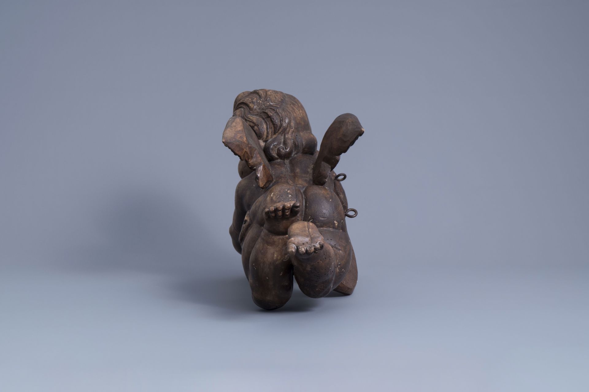 A patinated carved wooden figure of a putto, Southern Netherlands, 18th C. - Image 5 of 7