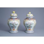 A pair of Chinese famille rose yellow ground vases and covers, Republic