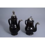 Two large silver mounted Namur black glazed pottery coffee pots, 18th C.
