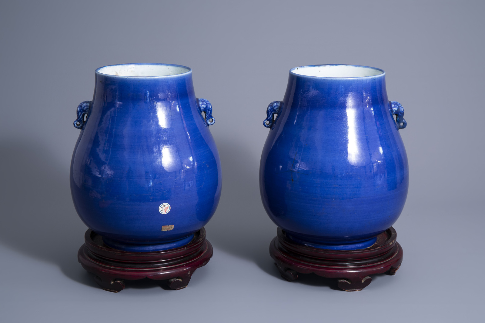 A pair of Chinese monochrome blue 'hu' vases, 19th C.