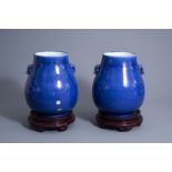 A pair of Chinese monochrome blue 'hu' vases, 19th C.