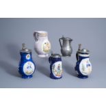 Four various Brussels polychrome faience jugs and a Lille pewter jug, mainly 19th C.