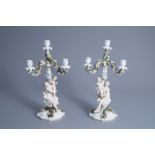 A pair of polychrome decorated Saxon porcelain four-light candelabra, Sitzendorf mark, 20th C.