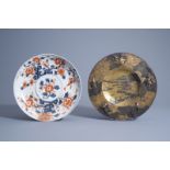 A Japanese parcel gilt bronze Miyao style dish with relief design and an Imari porcelain dish, Edo/M